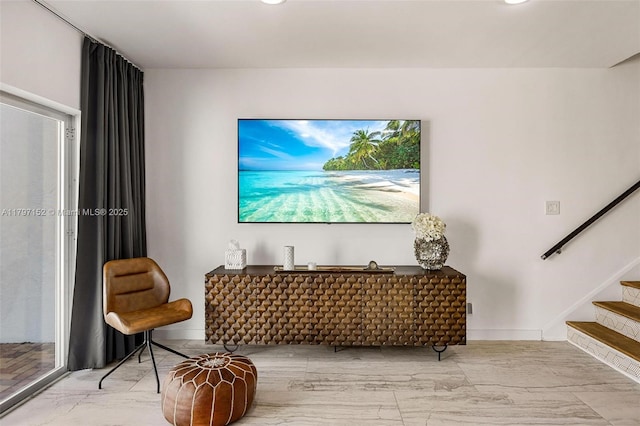 living area featuring baseboards, stairs, recessed lighting, and marble finish floor