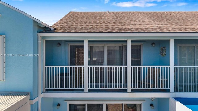 view of property exterior featuring stucco siding and a shingled roof