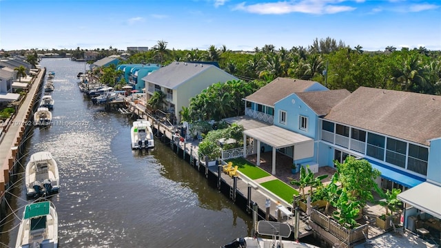 bird's eye view with a water view and a residential view