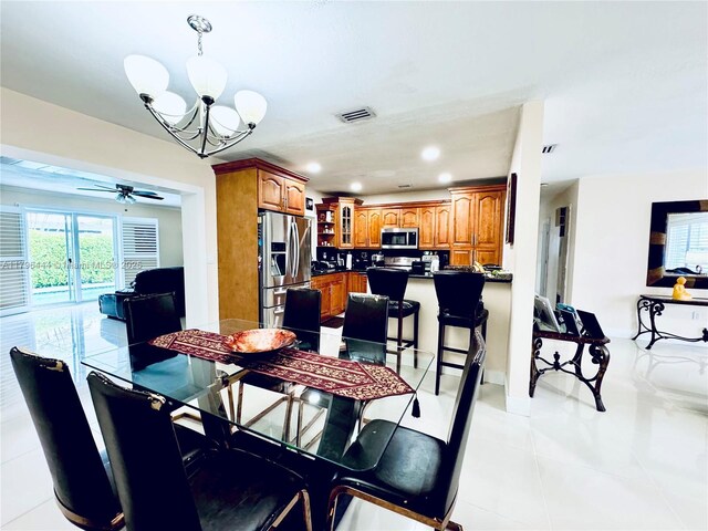 1245 SW 85th Ave, Miami, FL 33144 - dining room featuring light tile patterned floors, a chandelier, ceiling fan, and recessed lighting