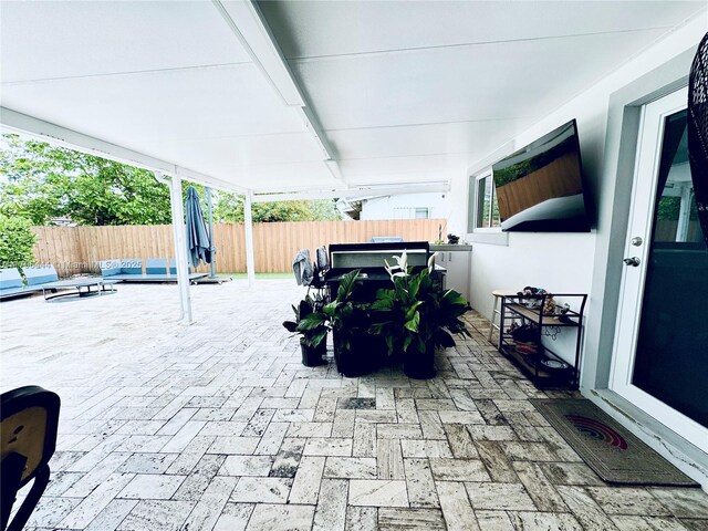 1245 SW 85th Ave, Miami, FL 33144 - fenced backyard featuring a patio area