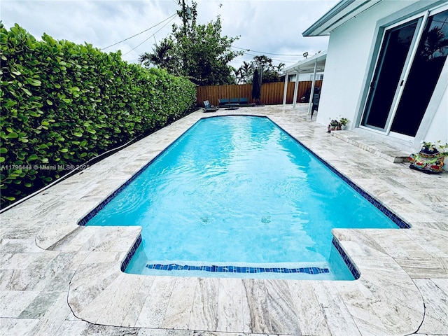 1245 SW 85th Ave, Miami, FL 33144 - view of swimming pool with a patio area and a fenced backyard