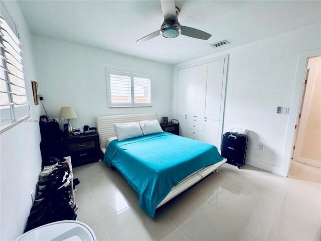 1245 SW 85th Ave, Miami, FL 33144 - bedroom featuring light tile patterned floors, a ceiling fan, and a closet