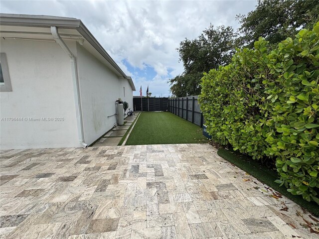 1245 SW 85th Ave, Miami, FL 33144 - fenced backyard with a patio