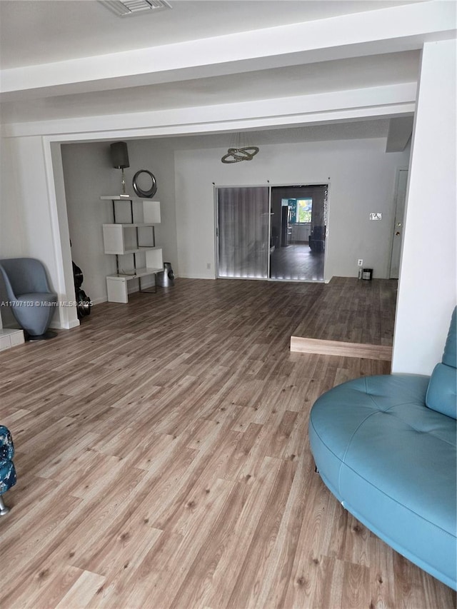living room with visible vents and wood finished floors