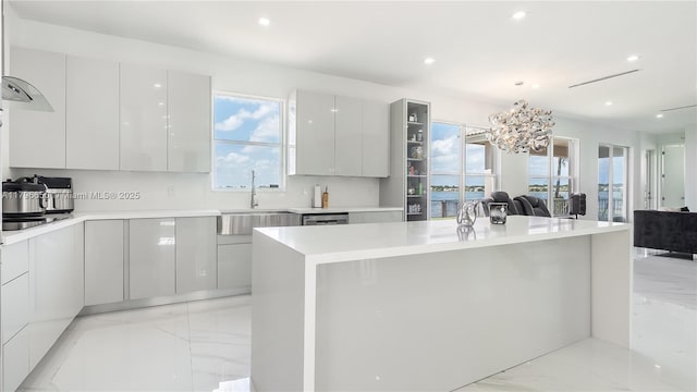 17739 SW 54th St, Miramar, FL 33029 - kitchen with marble finish floor, an inviting chandelier, open floor plan, and modern cabinets