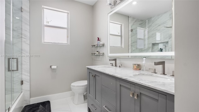 17739 SW 54th St, Miramar, FL 33029 - full bathroom with baseboards, toilet, a sink, and double vanity