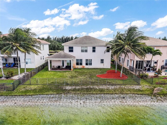 17739 SW 54th St, Miramar, FL 33029 - back of house featuring a yard, a patio area, a fenced backyard, and stucco siding