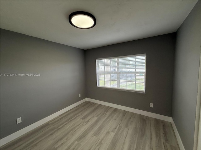 20570 NW 1st Ct, Miami Gardens, FL 33169 - spare room with baseboards and wood finished floors