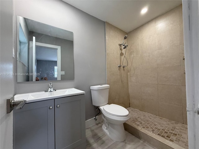 20570 NW 1st Ct, Miami Gardens, FL 33169 - bathroom featuring toilet, wood finished floors, tiled shower, baseboards, and vanity