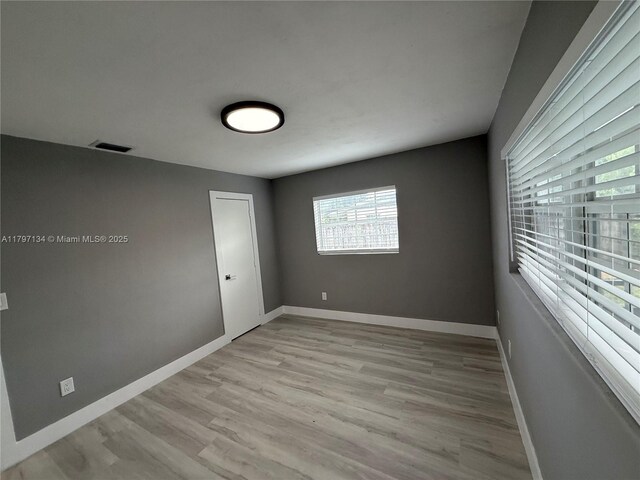 20570 NW 1st Ct, Miami Gardens, FL 33169 - spare room featuring light wood-type flooring and baseboards