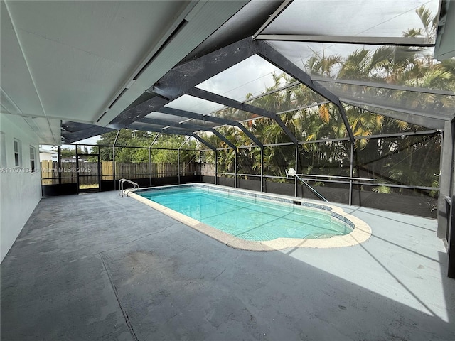 20570 NW 1st Ct, Miami Gardens, FL 33169 - view of swimming pool with a patio area, a fenced backyard, and a lanai