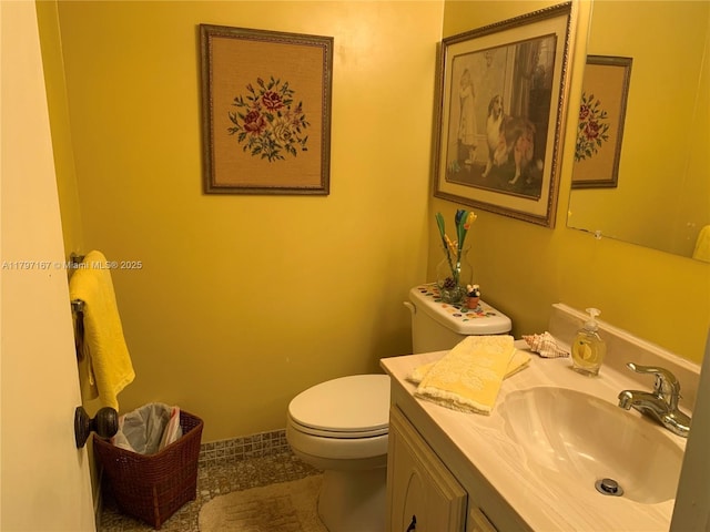 bathroom featuring vanity, toilet, and tile patterned floors