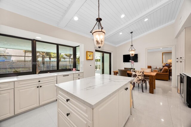 15920 SW 81st Ave, Palmetto Bay, FL 33157 - kitchen featuring a sink, a center island, light tile patterned floors, hanging light fixtures, and wooden ceiling