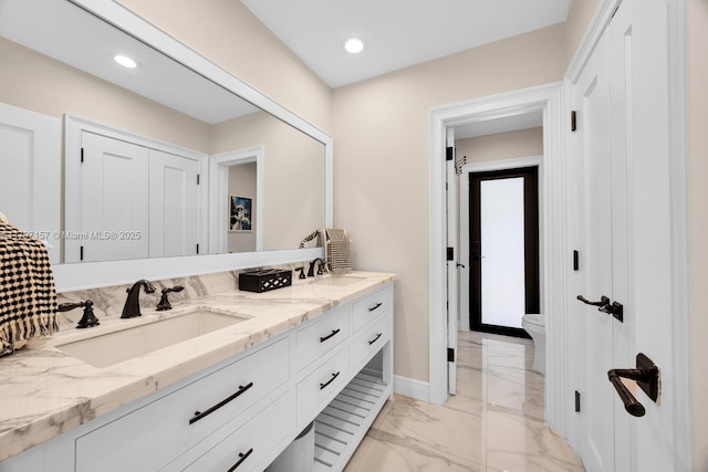 15920 SW 81st Ave, Palmetto Bay, FL 33157 - bathroom featuring marble look tile flooring, double vanity, baseboards, toilet, and recessed lighting