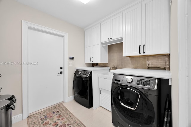 15920 SW 81st Ave, Palmetto Bay, FL 33157 - laundry room with cabinet space, washer and clothes dryer, baseboards, and light tile patterned floors