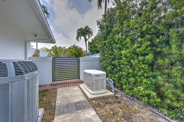 15920 SW 81st Ave, Palmetto Bay, FL 33157 - exterior view of a power unit, central AC, fence, and a gate