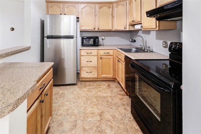 kitchen featuring black appliances, light brown cabinets, exhaust hood, and a sink