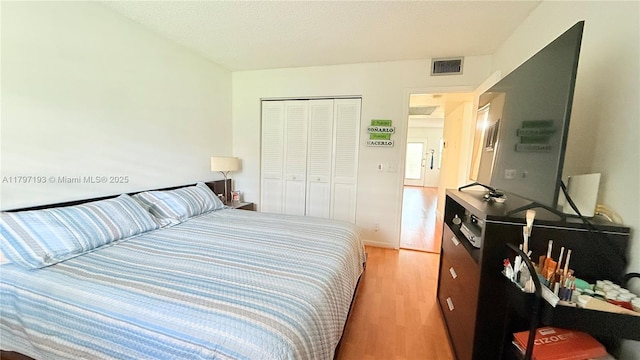 13450 SW 3rd St Unit 308D, Pembroke Pines, FL 33027 - bedroom with a closet, light wood-type flooring, and visible vents