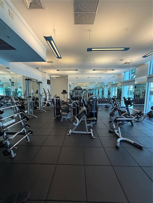 exercise room featuring expansive windows