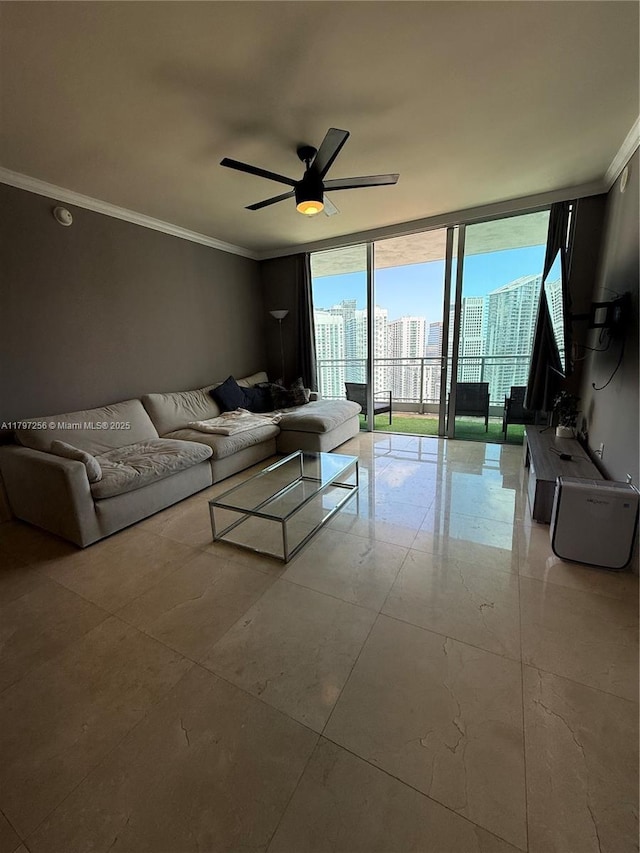 living room featuring ornamental molding, floor to ceiling windows, ceiling fan, and a city view