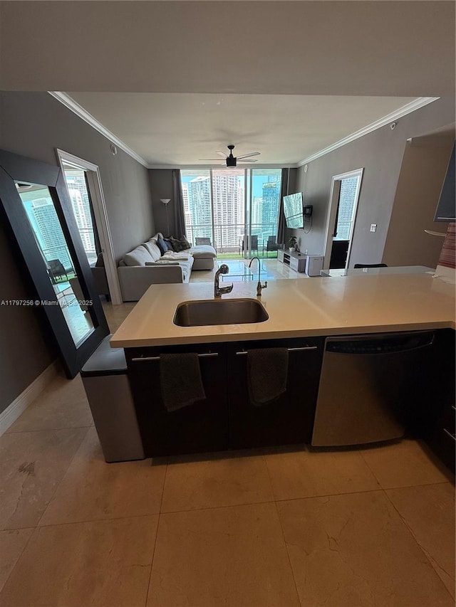 kitchen featuring a sink, crown molding, stainless steel dishwasher, open floor plan, and light countertops