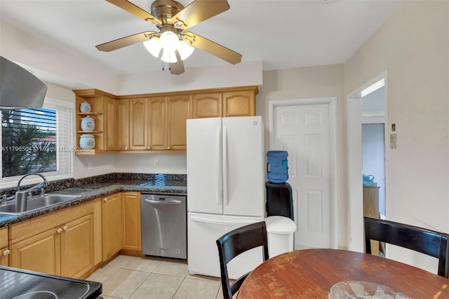 kitchen featuring freestanding refrigerator, stainless steel dishwasher, light tile patterned floors, a sink, and open shelves