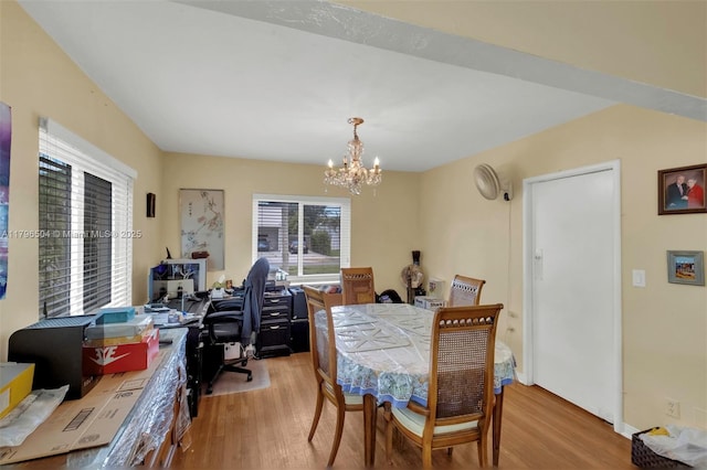 dining room featuring an inviting chandelier and wood finished floors