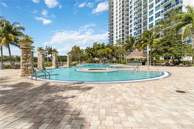 pool featuring a gazebo and a community hot tub