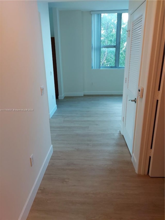2641 N Flamingo Rd Unit 307N, Sunrise, FL 33323 - corridor featuring baseboards and light wood-style floors