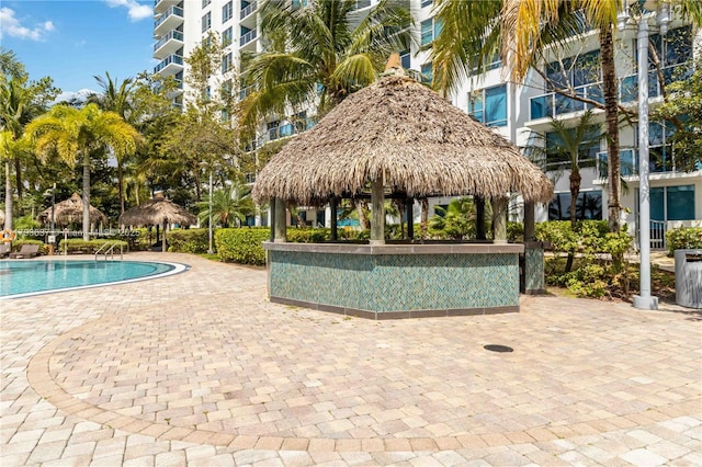 community pool featuring a patio area and a gazebo