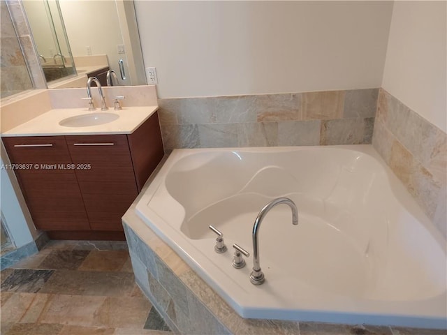 2641 N Flamingo Rd Unit 307N, Sunrise, FL 33323 - full bathroom with vanity, a bath, and stone finish floors