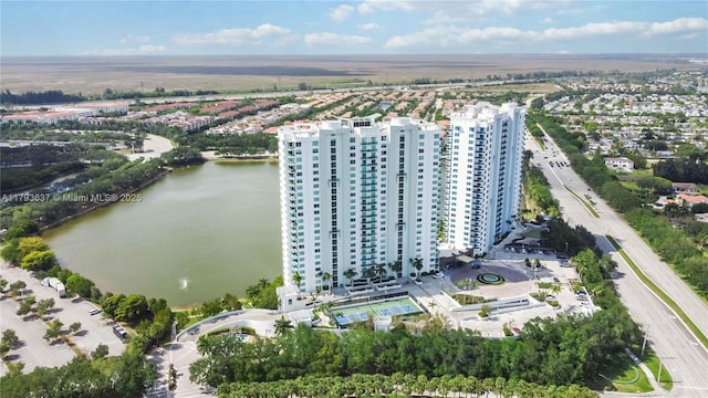 birds eye view of property featuring a water view