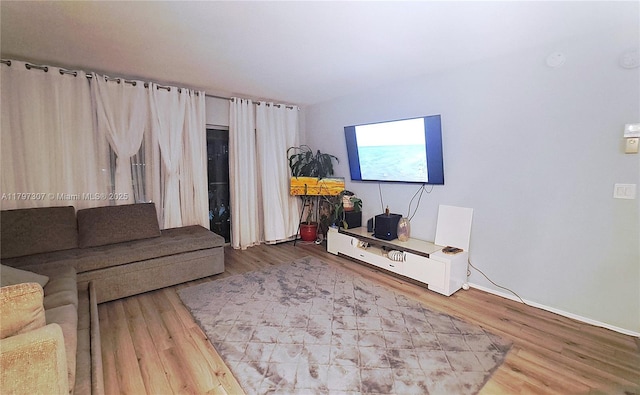 450 Golden Isles Dr Unit 2H, Hallandale Beach, FL 33009 - living room with wood finished floors