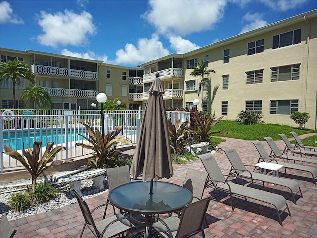 exterior space with fence and a patio