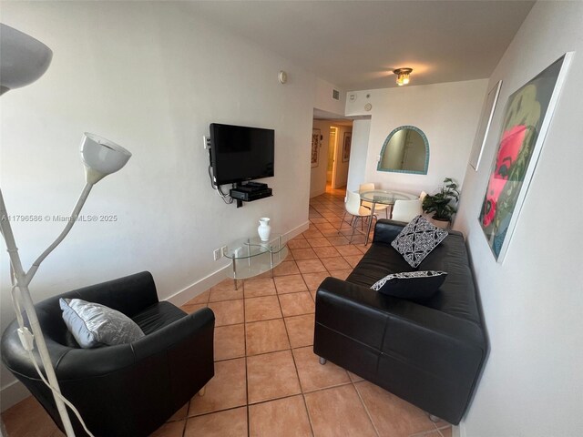 100 Lincoln Rd Unit 1209, Miami Beach, FL 33139 - living area with light tile patterned floors, visible vents, and baseboards