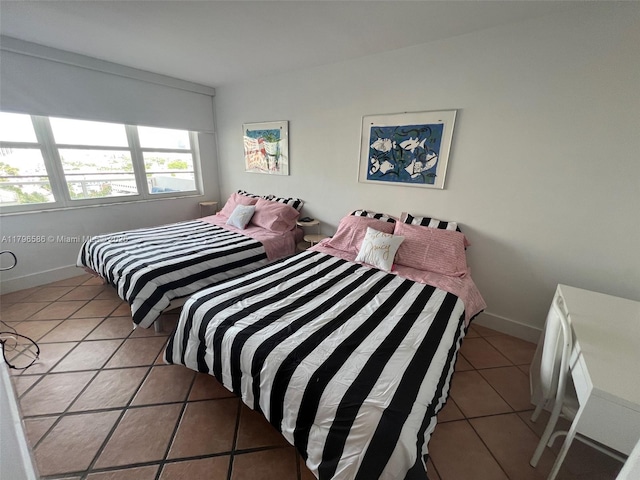 100 Lincoln Rd Unit 1209, Miami Beach, FL 33139 - bedroom with baseboards and light tile patterned flooring