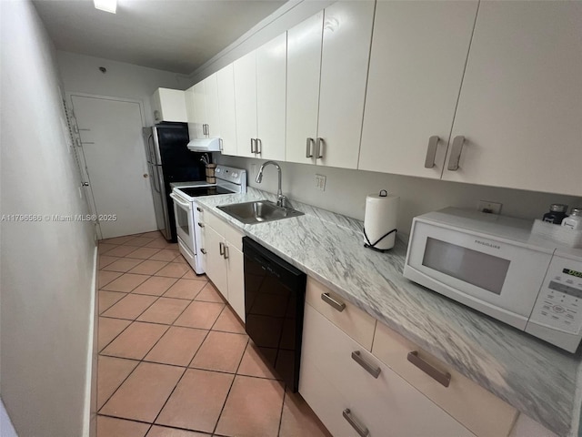 100 Lincoln Rd Unit 1209, Miami Beach, FL 33139 - kitchen with a sink, white appliances, white cabinetry, and light tile patterned floors