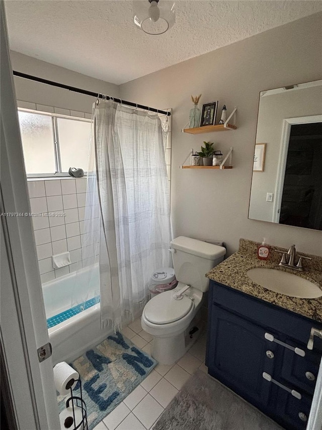 full bath with toilet, vanity, a textured ceiling, shower / bath combo, and tile patterned floors