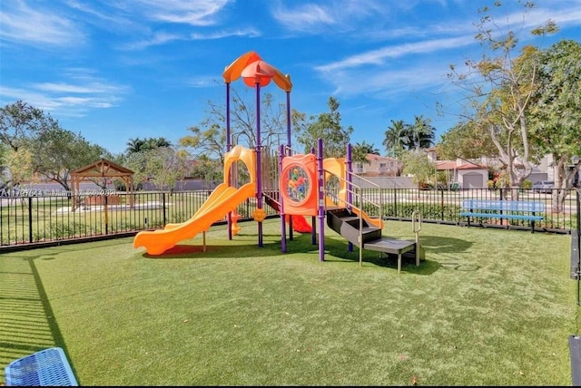 community playground featuring a yard, a gazebo, and fence