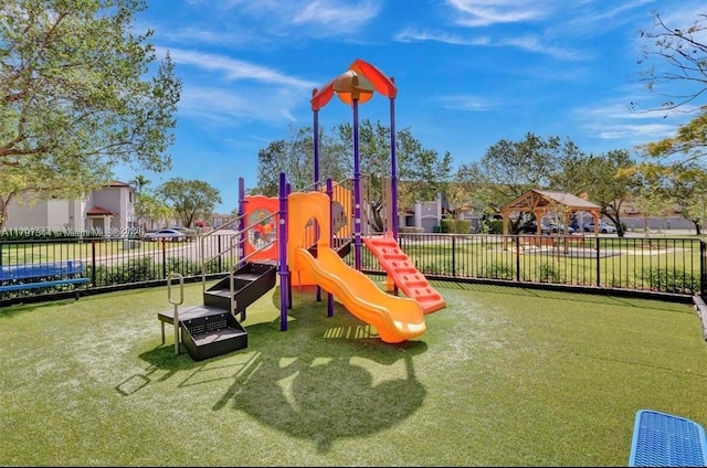 communal playground featuring fence