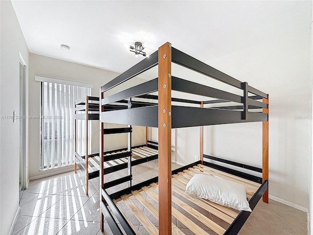 bedroom featuring baseboards