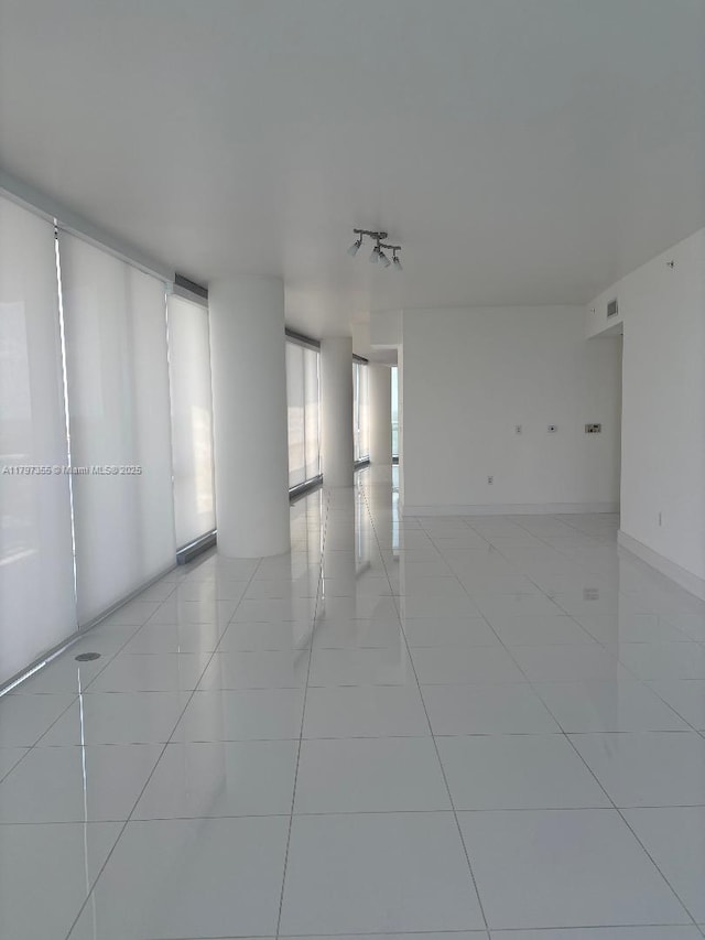 empty room with light tile patterned floors