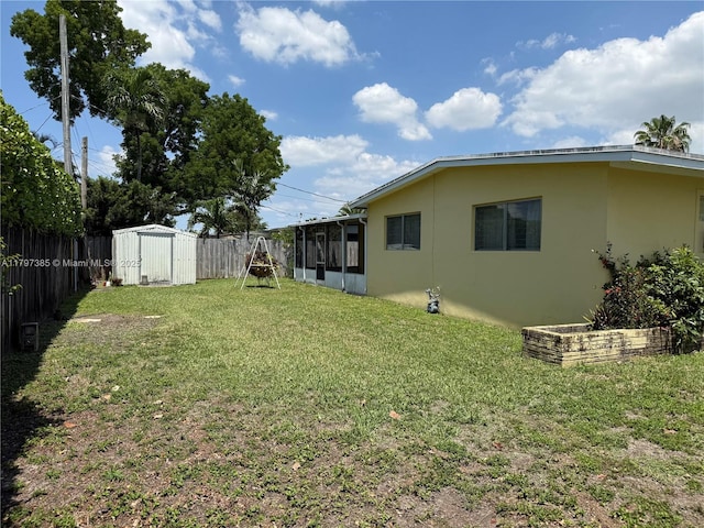 9300 SW 52nd Ter, Miami, FL 33165 - view of yard with a shed, a sunroom, and an outdoor structure