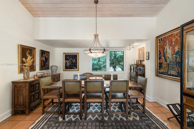 10301 E Broadview Dr, Bay Harbor Islands, FL 33154 - dining area with tile patterned floors, wood ceiling, baseboards, and crown molding