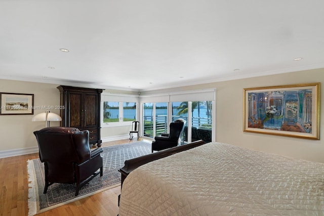 10301 E Broadview Dr, Bay Harbor Islands, FL 33154 - bedroom with light wood-style flooring, ornamental molding, baseboards, recessed lighting, and access to exterior