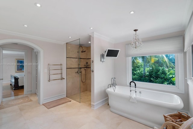 10301 E Broadview Dr, Bay Harbor Islands, FL 33154 - bathroom featuring a walk in shower, a freestanding bath, ornamental molding, baseboards, and recessed lighting