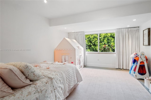 bedroom featuring baseboards and recessed lighting