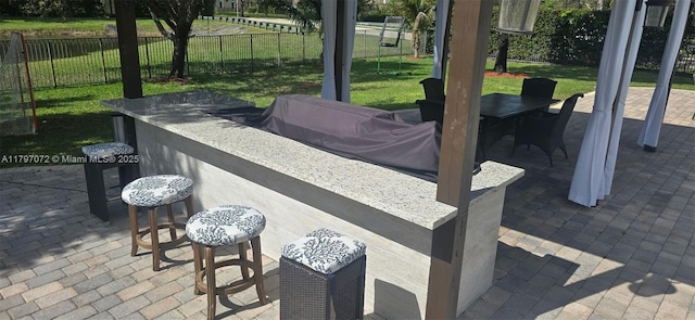 view of patio / terrace with fence and outdoor dining space