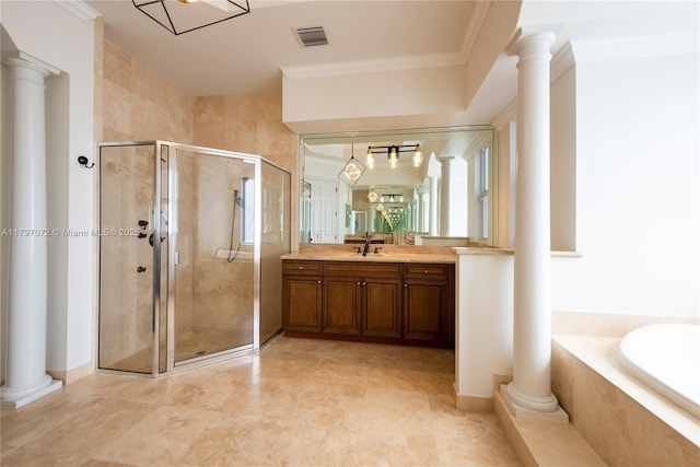 bathroom with vanity, a shower stall, decorative columns, and a bath